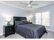 Comfortable bedroom featuring neutral tones, a ceiling fan, and natural light at 3100 Anderson Dr, Raleigh, NC 27609