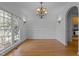 Formal dining room featuring classic details and hardwood floors at 311 Lilliput Ln, Wake Forest, NC 27587
