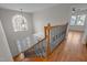 Foyer with hardwood floors, staircase, and large window providing plenty of natural light at 311 Lilliput Ln, Wake Forest, NC 27587