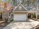 Charming home featuring a large garage, stone accents and a covered carport at 311 Lilliput Ln, Wake Forest, NC 27587