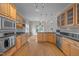 Kitchen featuring stainless appliances, hardwood floors, and eat-in area at 311 Lilliput Ln, Wake Forest, NC 27587