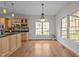 The dining area is open to the kitchen and features large windows for natural light at 311 Lilliput Ln, Wake Forest, NC 27587