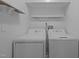 Laundry room with washer, dryer and utility shelves at 311 Lilliput Ln, Wake Forest, NC 27587