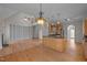 View of open living space with kitchen, fireplace, and second story access at 311 Lilliput Ln, Wake Forest, NC 27587