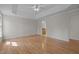 Spacious main bedroom featuring tray ceilings, hardwood floors, and access to the en suite bathroom at 311 Lilliput Ln, Wake Forest, NC 27587