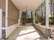 Covered patio surrounded by woods at 311 Lilliput Ln, Wake Forest, NC 27587