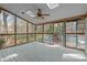 Screened in porch with skylights and a ceiling fan overlooking a private back yard at 311 Lilliput Ln, Wake Forest, NC 27587