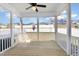 Cozy screened-in back porch with a ceiling fan and views of the spacious backyard at 332 Tumbling River Dr, Wendell, NC 27591