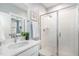 Modern bathroom with a glass shower, white cabinets, and a sleek design at 332 Tumbling River Dr, Wendell, NC 27591