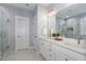 Spacious bathroom with double vanity sinks, a glass-enclosed shower, and modern fixtures at 332 Tumbling River Dr, Wendell, NC 27591