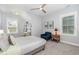 Comfortable bedroom featuring a ceiling fan, natural light, and a calming color palette at 332 Tumbling River Dr, Wendell, NC 27591