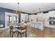 Open concept dining room with a view of the modern kitchen with a large center island at 332 Tumbling River Dr, Wendell, NC 27591