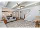 Open-concept living space with hardwood floors, a ceiling fan, and recessed lighting at 332 Tumbling River Dr, Wendell, NC 27591