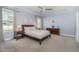 Calm main bedroom with lots of light, ceiling fan, carpet, and a tray ceiling at 332 Tumbling River Dr, Wendell, NC 27591