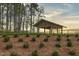 Community outdoor pavilion with landscaping, ideal for gatherings and outdoor activities at 332 Tumbling River Dr, Wendell, NC 27591