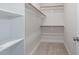 This is a view of the closet with shelving and a wooden rod for ample storage space at 332 Tumbling River Dr, Wendell, NC 27591