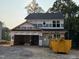 New two-story home under construction with visible framing, windows, and construction materials at 35 Fetterbush Way, Clayton, NC 27520