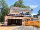 New construction two-story home with attached two-car garage featuring contemporary design details at 35 Fetterbush Way, Clayton, NC 27520