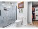 Modern bathroom with marble-look tiled shower with black frame, and a window at 4012 Old Sturbridge Dr, Apex, NC 27539