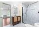 Modern bathroom with wood vanity, marble-look tiled shower with black frame at 4012 Old Sturbridge Dr, Apex, NC 27539