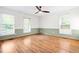 Spacious bedroom features stylish paneling, neutral walls, and modern flooring at 4012 Old Sturbridge Dr, Apex, NC 27539