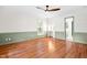 Spacious bedroom with modern flooring, neutral paint scheme, and attached bathroom at 4012 Old Sturbridge Dr, Apex, NC 27539