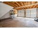 Spacious three car garage with storage shelves and automatic doors at 4012 Old Sturbridge Dr, Apex, NC 27539