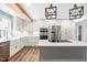 Bright kitchen showcases an island with cooktop, stainless appliances, and ample cabinet space at 4012 Old Sturbridge Dr, Apex, NC 27539