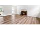Spacious living room includes a brick fireplace and access to the outdoors at 4012 Old Sturbridge Dr, Apex, NC 27539