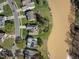 Aerial view of waterfront homes showcasing well-maintained lawns and river access at 406 Southshore Pkwy, Durham, NC 27703