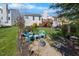 Relaxing backyard features a fire pit and outdoor seating area, perfect for enjoying the outdoors at 406 Southshore Pkwy, Durham, NC 27703