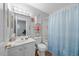 Well-lit bathroom featuring vanity, drawers and cabinet storage, plus a shower-tub combination at 406 Southshore Pkwy, Durham, NC 27703