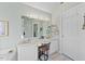 Well-lit bathroom with dual sinks, ample counter space, and a decorative mirror enhancing the space at 406 Southshore Pkwy, Durham, NC 27703