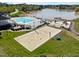 Aerial view of the lakefront community amenities including a beach volleyball court and playground at 406 Southshore Pkwy, Durham, NC 27703