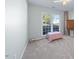 Bright bedroom with large window, light-filled space, and neutral carpet at 406 Southshore Pkwy, Durham, NC 27703