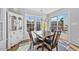 Inviting dining area with natural light, wood table set, and easy access to the outdoor patio at 406 Southshore Pkwy, Durham, NC 27703