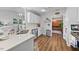 Charming kitchen featuring light countertops, stainless steel appliances, and open access to other living areas at 406 Southshore Pkwy, Durham, NC 27703
