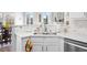 Kitchen featuring white cabinets, stainless steel appliances, and lots of counter space at 406 Southshore Pkwy, Durham, NC 27703