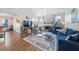 Inviting living room with a cozy fireplace, hardwood floors and comfortable seating at 406 Southshore Pkwy, Durham, NC 27703