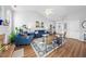 Bright living room featuring wood floors, comfortable furniture, and lots of natural light at 406 Southshore Pkwy, Durham, NC 27703