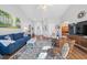 Bright and airy living room with wood floors, fireplace and comfortable seating at 406 Southshore Pkwy, Durham, NC 27703