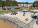 Vibrant community playground with slides, swings, climbing structures, and a sand pit at 406 Southshore Pkwy, Durham, NC 27703