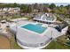 Community pool with ample deck space, a clubhouse and lake views offering a resort-like experience at 406 Southshore Pkwy, Durham, NC 27703