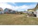 Large, fenced backyard with a covered patio, perfect for outdoor gatherings and enjoying the green space at 428 Beaverdam Lake Dr, Fuquay Varina, NC 27526