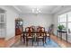 Spacious dining room featuring a classic chandelier and ample natural light from the window at 428 Beaverdam Lake Dr, Fuquay Varina, NC 27526