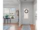 Bright foyer featuring hardwood floors, a decorative rug, and a view to the outside at 428 Beaverdam Lake Dr, Fuquay Varina, NC 27526