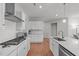 Bright kitchen featuring stainless steel appliances, white cabinets, countertops, and stylish backsplash at 428 Beaverdam Lake Dr, Fuquay Varina, NC 27526