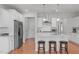 Modern kitchen featuring white cabinets, a central island, and stainless steel appliances at 428 Beaverdam Lake Dr, Fuquay Varina, NC 27526