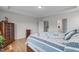 Spacious bedroom with hardwood floors, a view of a connected bathroom, and ample closet space at 428 Beaverdam Lake Dr, Fuquay Varina, NC 27526
