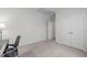 Large office space with bright white walls, a view to another room, and an expansive closet at 428 Beaverdam Lake Dr, Fuquay Varina, NC 27526